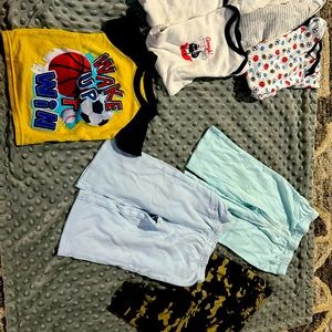 6 onsies, 3 pairs of pants and 1 short sleeved pajama shirt